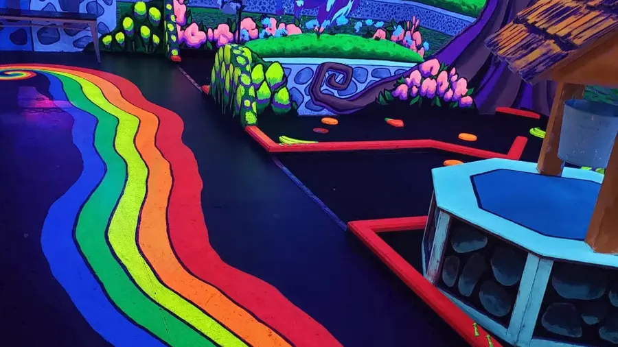 Glowing rainbow mini golf course at Imagine 3D Mini Golf Gilbert