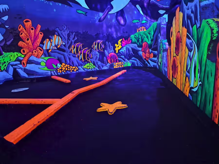 Coral reef mural with tropical fish at Imagine 3D Mini Golf Gilbert