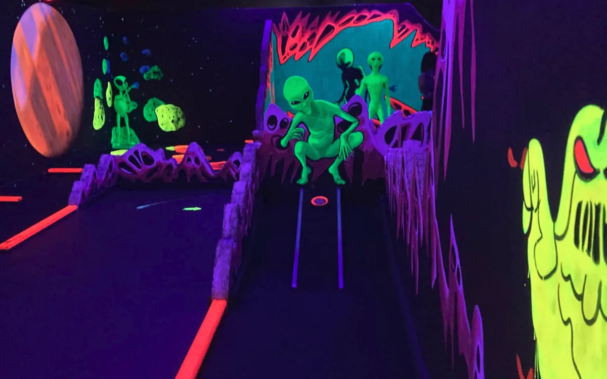 Alien-themed blacklight 3D mini golf course at the Scottsdale location