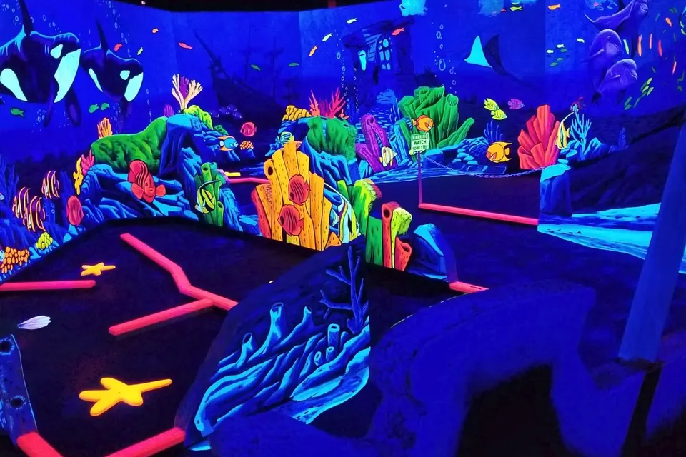 Neon-painted mural walls on the 3D mini golf course, Gilbert