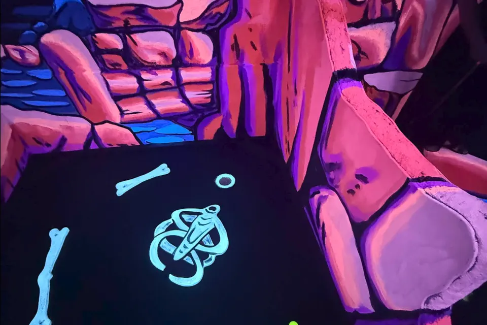Glowing red rock canyon mural at Imagine 3D Mini Golf Sedona