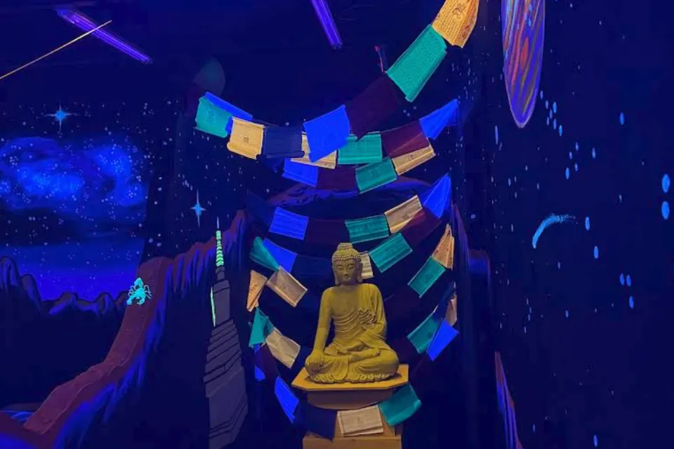 Hand-painted waterfall mural at Imagine 3D Mini Golf Sedona
