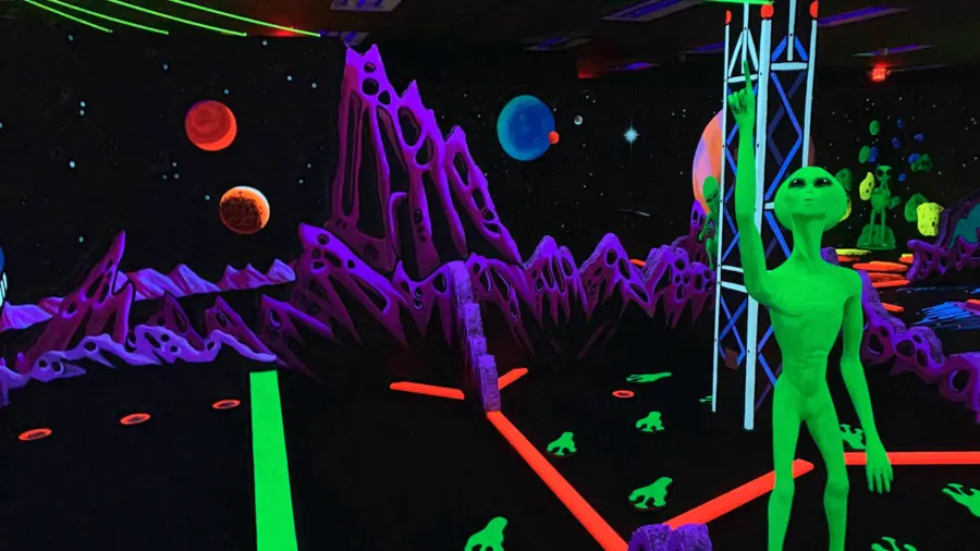 Alien landscape blacklight mini golf hole at Imagine 3D Mini Golf Scottsdale