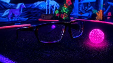 3D glasses on a glowing blacklight mini golf course at Scottsdale