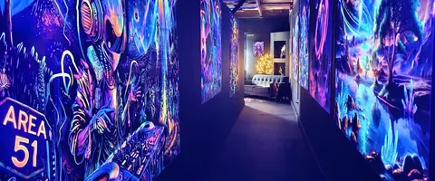 Glowing mural corridor at Imagine 3D Mini Golf Sedona