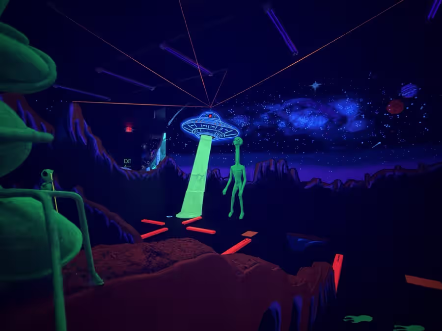 Glowing UFO beaming down onto an alien landscape mural
