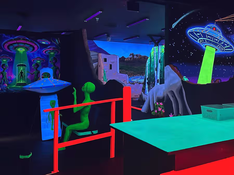 Alien abduction mural above the party lounge area