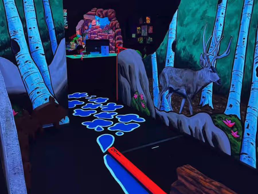 Blacklight forest path with painted deer at Sedona