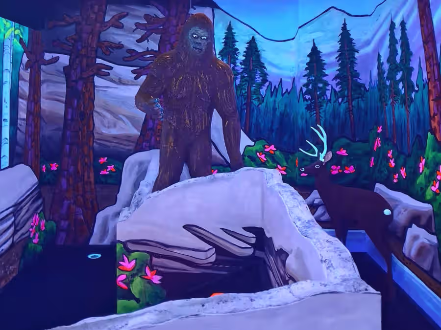 Bigfoot statue and deer on the forest-themed hole