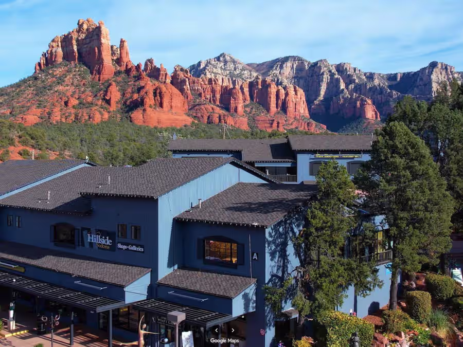 Hillside Sedona shopping center exterior with red rock backdrop